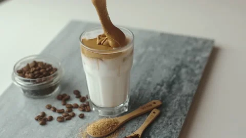 Cooking process of  dalgona coffee with almond milk and brown sugar Stock Footage 130383559