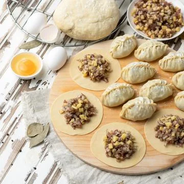 Cooking process. Dumplings stuffed with minced meat and cheese. Convenience Food Stock Photos