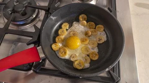Cooking process of fried bananas with scrambled eggs. Fried Banana with eggs  Stock Photos