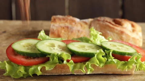 Cooking process making roast beef sandwich with tomato cucumber  salad Stock Footage 90190117