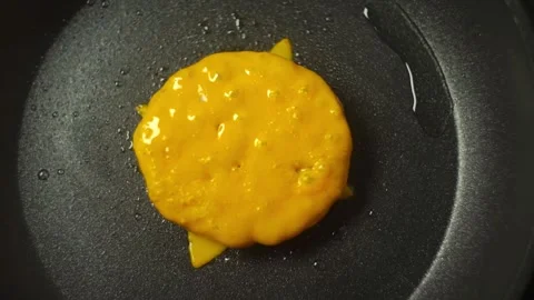 Cooking process of melting cheese in a frying pan, texture and color Stock Footage 324741601