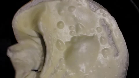 Cooking process of a pancake in a frying pan Stock Footage 332250882