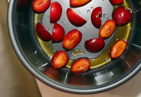 Cooking process of plum slices view from above Stock Photos