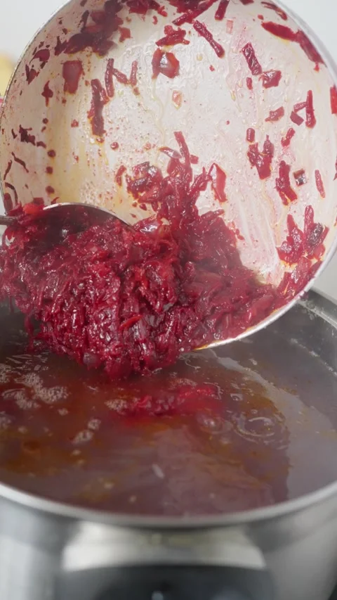 Cooking Process Preparation of a Colorful Red Dish in a Pot for Delicious Meals Stock Footage 316822100