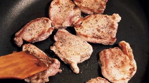 Cooking process of a red organic meat, on a sizzling frying pan, home cook Stock Footage 65449195