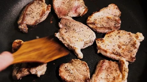Cooking process of a red organic meat, on a sizzling frying pan, home cook Stock Footage 65449250