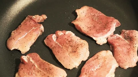 Cooking process of a red organic meat, on a sizzling frying pan, home cook Stock Footage 65449253