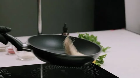 The cooking process of roasting sesame seeds on frying pan Stock Footage 150306010