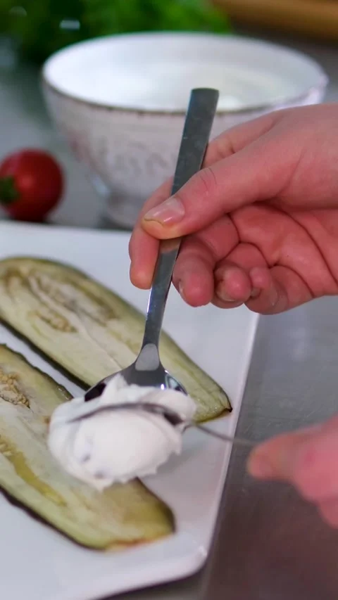Cooking process of rolling grilled zucchini eggplant slices filled creamy cheese Video stock 318976890