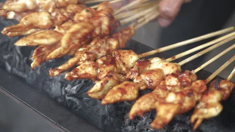 Cooking Process of Satay on a grill plate outdoor Stock Footage 273582516