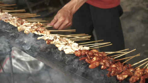 Cooking Process of Satay on a grill plate outdoor Stock Footage 273586686