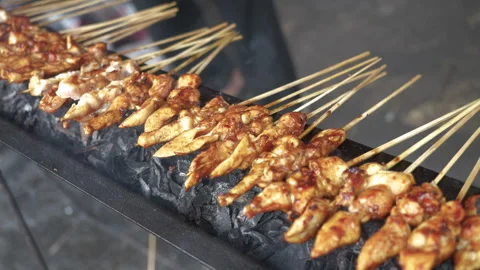 Cooking Process of Satay on a grill plate outdoor Stock Footage 273586703