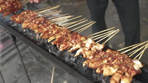 Cooking Process of Satay on a grill plate outdoor Stock Footage 273587994