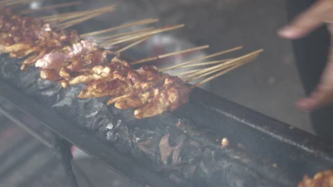 Cooking Process of Satay on a grill plate outdoor Stock Footage 273589046