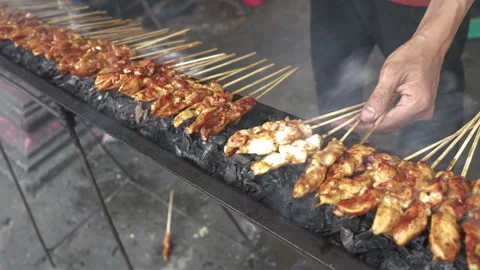 Cooking Process of Satay on a grill plate outdoor Stock Footage 273589402