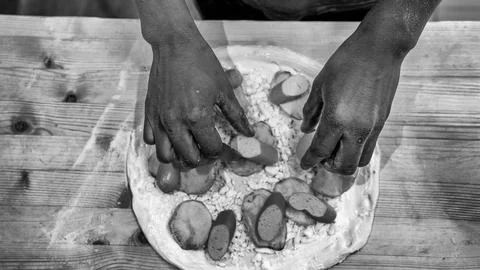 Cooking process showing a chef crafting a delicious homemade pizza step by st 写真素材