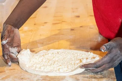 Cooking process showing a chef crafting a delicious homemade pizza step by st Stock Photos