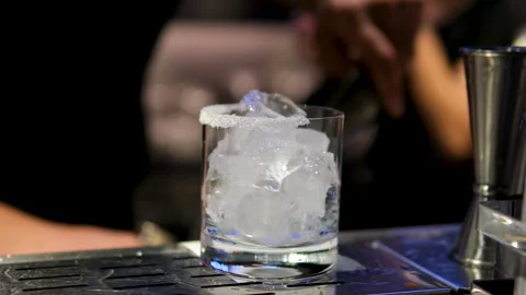 Cooking process Step by step Close up of a professional bartender is mixing gin Stock Footage 294793623