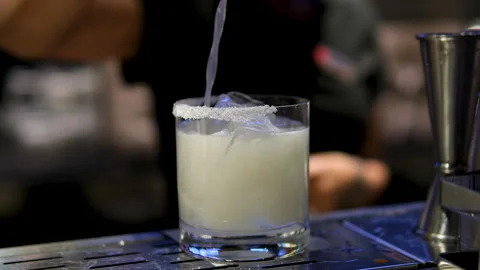 Cooking process Step by step Close up of a professional bartender is mixing gin Stock Footage 294793771