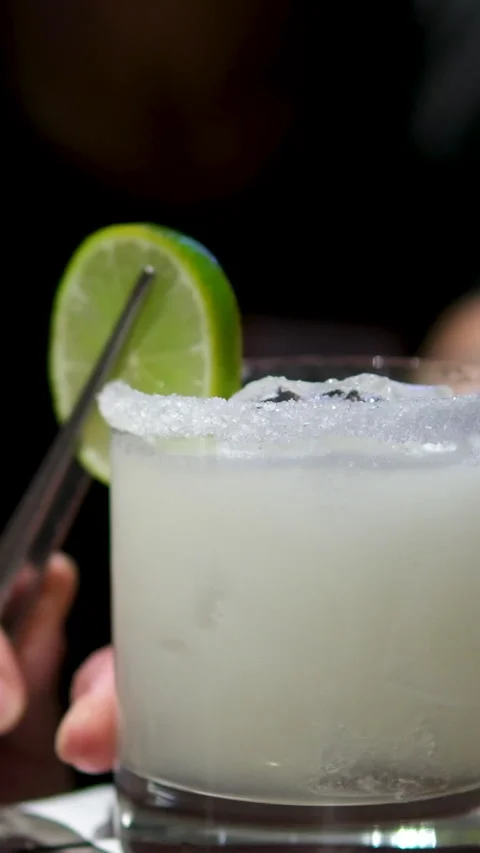 Cooking process Step by step Close up of a professional bartender is mixing gin Stock Footage 295158211