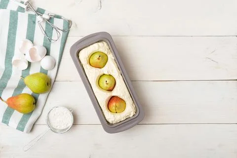 Cooking process step-by-step pear cake. Pouring dough into silicone mold. Ste Stock Photos