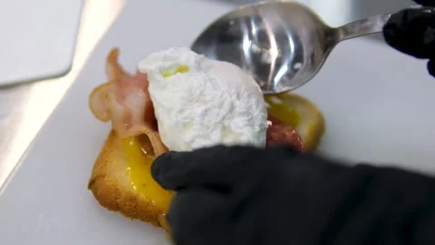 Cooking process Step by step. Pouring sauce on benedict egg with stracciatella Stock Footage 278351310