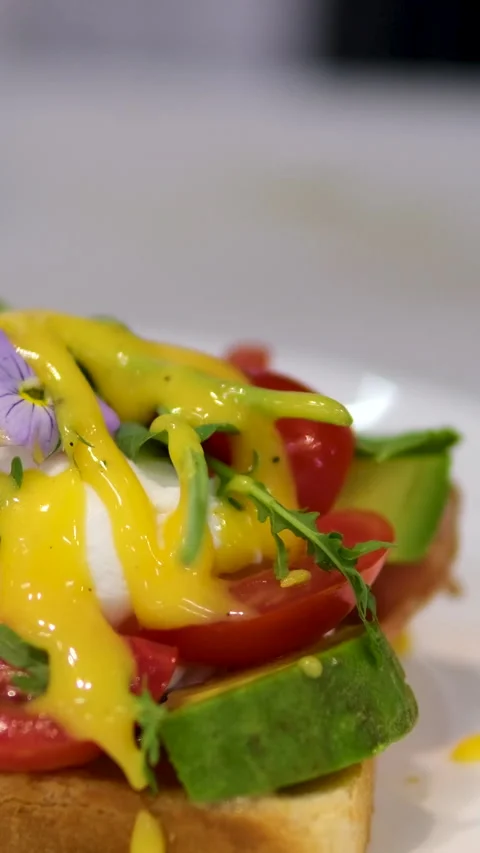 Cooking process Step by step. Pouring sauce on benedict egg with stracciatella Stock Footage 278404811