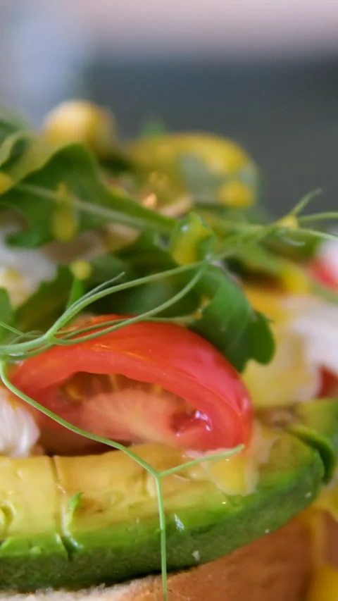 Cooking process Step by step. Pouring sauce on benedict egg with stracciatella Stock Footage 278405121