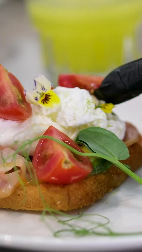 Cooking process Step by step. Pouring sauce on benedict egg with stracciatella Stock Footage 278405153