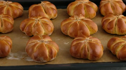 Cooking pumpkin buns. Ready pumpkin buns were taken out of the oven on baking Video stock 141767931
