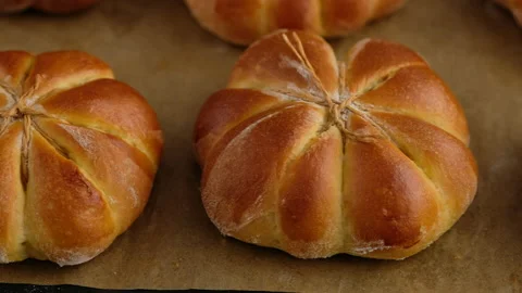 Cooking pumpkin buns. Ready pumpkin buns were taken out of the oven on baking Stock Footage 141768317