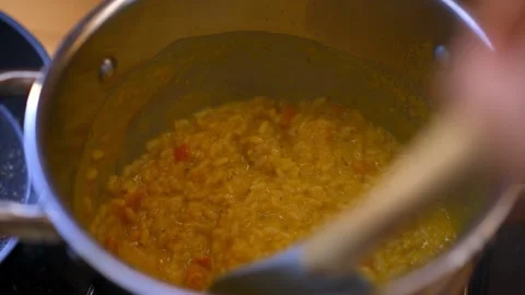 Cooking pumpkin risotto on a cooking pot Stockbeeldmateriaal 265659279