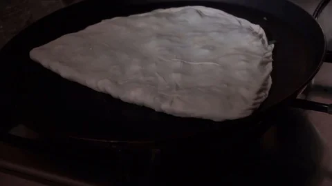 Cooking qutab on a pan Stock Footage 106198801