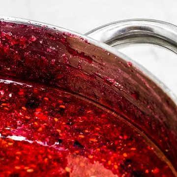 Cooking raspberry jam Stock Photos