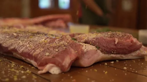 Cooking Raw Big Pork with Spices Stock Footage 137900402