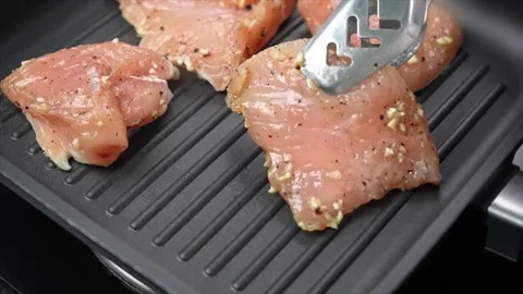 Cooking raw chicken meet fried on grill pan and Raw chicken frying Video stock 286073313