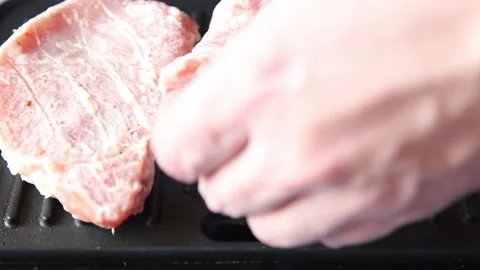 Cooking raw meat steaks in grilled sauce by the chef. Stock Footage 152770110