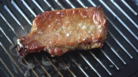 Cooking raw steak on the pan. Stock Footage 86533423