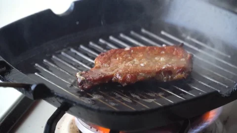 Cooking raw steak on the pan. Stock Footage 86533444