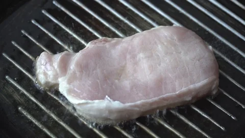 Cooking raw steak on the pan. Video stock 88398529