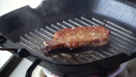 Cooking raw steak on the pan. Video stock 88398558