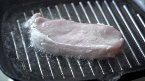 Cooking raw steak on the pan. Video stock 88614554
