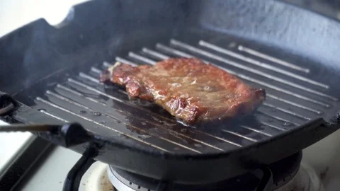 Cooking raw steak on the pan. Video stock 88614590