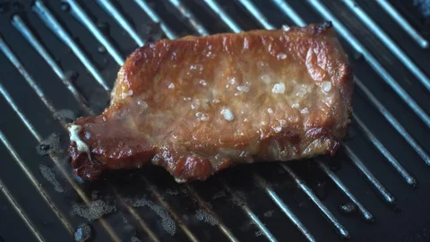 Cooking raw steak on the pan. Stock Footage 88667526