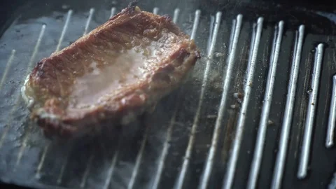 Cooking raw steak on the pan. Stock Footage 88707046