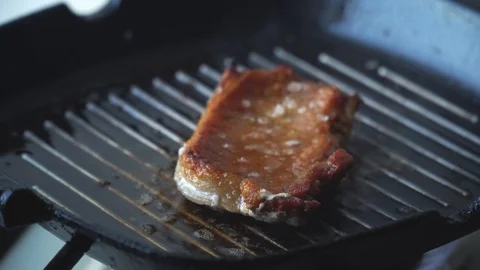 Cooking raw steak on the pan. Stock Footage 88707067