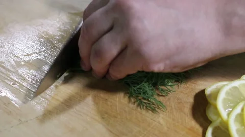 Cooking red fish on fire with lemon and onion and herbs Stock Footage 134199269