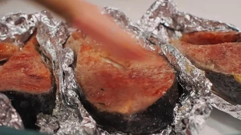 Cooking red fish steak in foil Stock Footage 307384149
