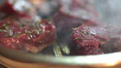 Cooking red meat on a pan with a fork for a delicious dish Stock Footage 269964150