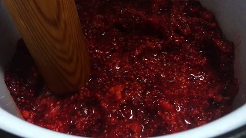 Cooking red raspberry jam in a pan. Stock Footage 111814825